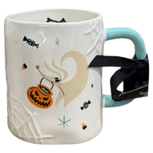 Load image into Gallery viewer, A white ceramic mug with a Halloween theme, featuring a hound ghost holding an orange jack-o'-lantern bucket, and small candy motifs. The mug has a light blue handle and is wrapped with a black ribbon.
