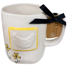 Load image into Gallery viewer, back of mug that has yellow flowers and a bumped out image of a chicken in a yellow frame.
