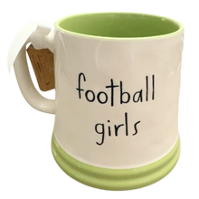Load image into Gallery viewer, A ceramic mug with a white exterior, light green interior and base, and the words 'football girls' printed in black script on the front.
