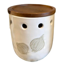 Load image into Gallery viewer, White ceramic container with brown lid featuring garlic designs on a white background
