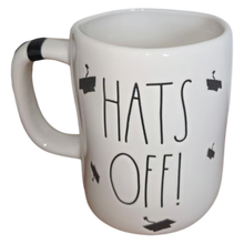 Load image into Gallery viewer, White mug with 'Hats Off!' text and graduation caps on a white background

