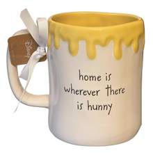 Load image into Gallery viewer, Mug with yellow interior, white exterior, and text 'home is wherever there is hunny' on a white background.
