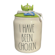 Load image into Gallery viewer, White canister that says 'I Have Been Chosen' and has a green lid with a Toy Story alien head as the handle.

