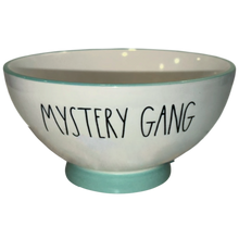 Load image into Gallery viewer, A white ceramic bowl with a light teal rim and base, featuring the words 'MYSTERY GANG' printed in black handwritten-style lettering on the front.

