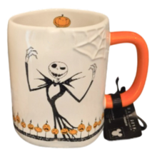 Load image into Gallery viewer, A ceramic mug featuring Jack Skellington from The Nightmare Before Christmas, with an orange handle and a black hangtag attached.
