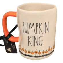 Load image into Gallery viewer, An off-white ceramic mug with a bright orange handle, featuring the text 'PUMPKIN KING' in black lettering and a row of small jack-o'-lantern illustrations along the bottom. A black hangtag is attached to the handle.
