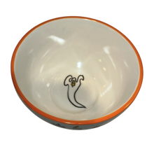 Load image into Gallery viewer, A white ceramic bowl with an orange rim, featuring a black and gold ghost illustration printed inside near the bottom center.
