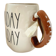 Load image into Gallery viewer, An off-white ceramic mug with a brown football-shaped handle and a white ribbon loop, featuring the text 'Sunday' Funday" printed in black on the side.
