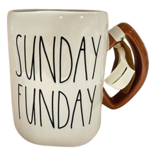 Load image into Gallery viewer, An off-white ceramic mug with the words 'SUNDAY FUNDAY' printed in black handwritten-style lettering. The handle is shaped like a football with a white ribbon tied around it, set against a plain white background.
