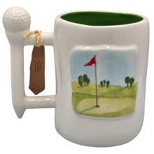 Load image into Gallery viewer, Golf-themed mug with golf club handle, golf ball on top, green interior and golf course design on a white background.
