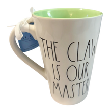 Load image into Gallery viewer, Mug with 'The Claw is Our Master' text on a white background with a green interior.
