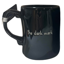 Load image into Gallery viewer, A glossy black ceramic mug with a handle shaped like a swirl on the ends, featuring the text 'the dark mark' in white lettering on the front.
