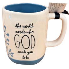 Load image into Gallery viewer, A ceramic mug with a cream-colored exterior, a blue interior and base, and black text that reads 'the world needs who GOD made you to be'.
