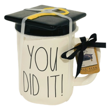 Load image into Gallery viewer, A White mug that says 'You Did it' with a lid that is shaped like a graduation cap.
