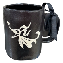 Load image into Gallery viewer, A black ceramic mug featuring a white silhouette of the Disney character Zero, with a black ribbon tag attached to the handle.
