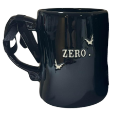 Load image into Gallery viewer, A glossy black ceramic mug with a sculptural handle, featuring the word 'ZERO.' and bat silhouettes in white on the front, set against a plain white background.
